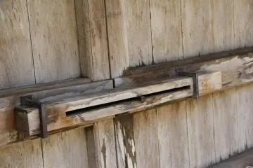 The actual door at the gate is made of wood