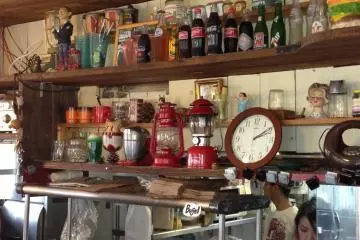 <p>The view from the barstools at Gordie's is full of Americana and provides full view of burger preparation and bread making</p>