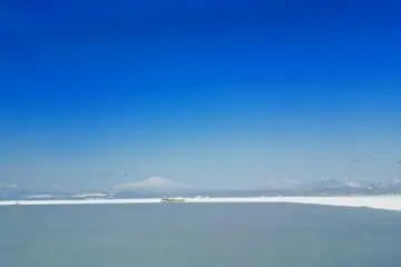 Mt.Chokai seen from Lake Nonomura in Mamurogawa Town in winter. Mt. Chokai is a 2,236 meters high mountain