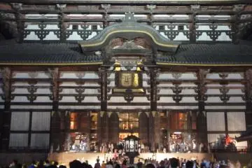 The buddha statue can be seen through the square opening in this photograph: the night-time view is so calm and very different from the the daytime view