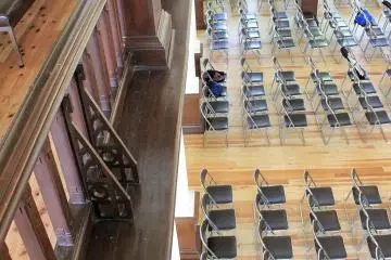 Looking down from the second floor balcony induces vertigo