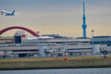 Passing by Haneda Airport.  Plane taking off with Skytree in the background