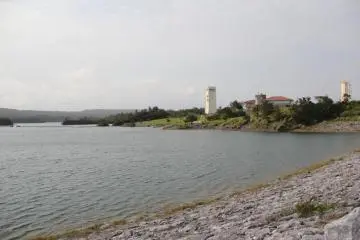 <p>Kurashiki Dam, as seen from the road across it, is the largest in Okinawa by surface area</p>