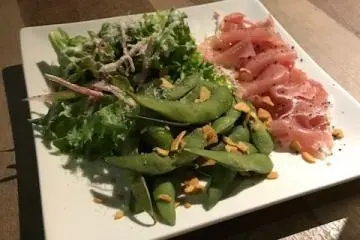 Tasty smoked salmon with salad and edamame beans