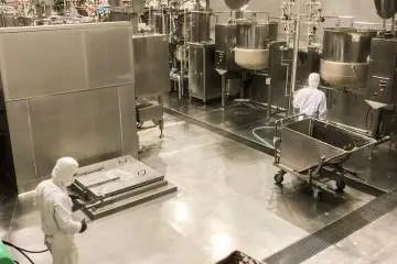 Huge caldrons and carts filled with red bean paste.