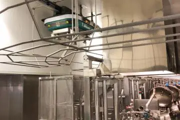 Cute little automated robots transporting the red beans