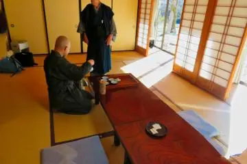 Monk preparing tea before Zazen Meditation