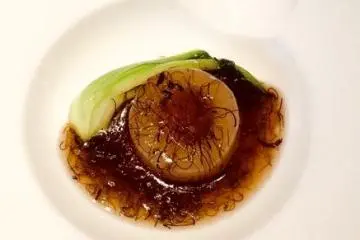 Scallop and bok choy in amber sauce.