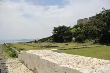 <p>White limestone atop aged and worn sections of the ruins signal that the restoration continues</p>