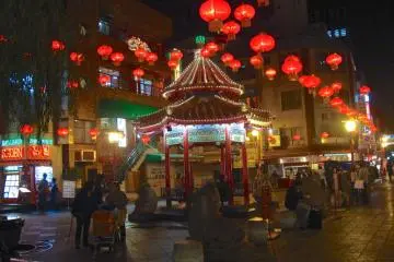 People hang out near the Nankinmachi Square, Motomachi