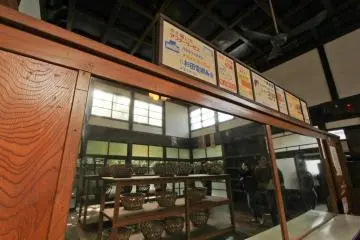 The changing room of the bath house, complete with classic ads of the local stores