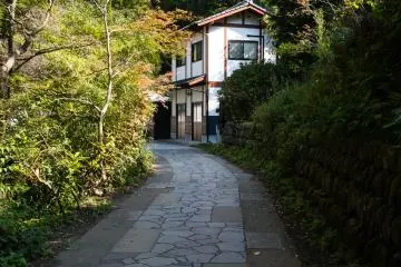 Closer to the spring, the path becomes paved again