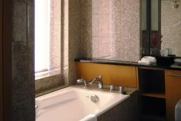 Panoramic sky views from the bath of the guest room at Cerulean Hotel Tokyu Shibuya