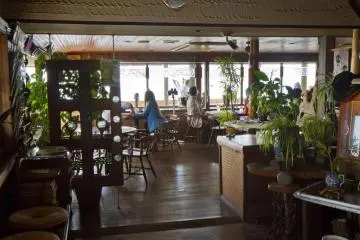 A welcoming interior with a wall of windows facing the sea