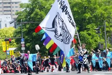 Black and white checkered costumes with a huge demon flag- this group is a crowd favorite