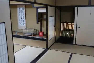 One of the fusuma (paper doors) has a little secret behind it, a window that looks down at the sake brewery work-space