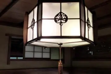 The hollyhock emblem is incorporated into fixture space and woodwork