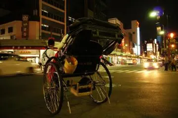 The shiny spokes of the rickshaws