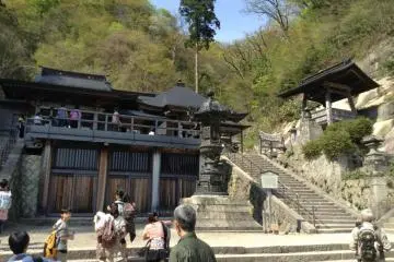 After almost 30 minutes of huffing up the mountain you have reached the top. A Buddhist statue can be viewed in the temple from the outside.
