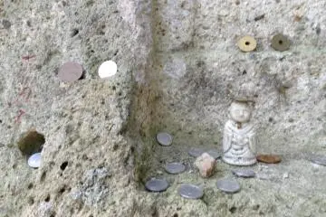 With all the energy you have while going down, make sure to explore anything you may have missed on the way up. Of particular interest is an area where travelers leave coins balanced precariously off and in rocks.