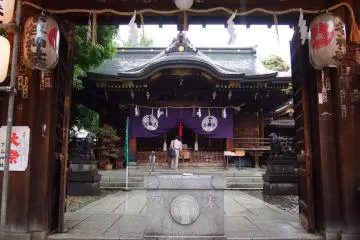 Moment of peace in the busy shrine. The building inside is the main one.