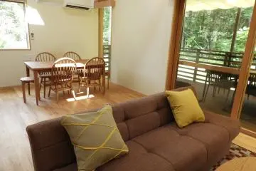A living room and eat-in kitchen in a Cottage