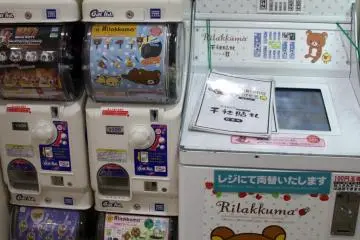 A name label sticker printing machine on the right. For the more popular characters and characters who take up major floor space, there's usually something extra like this machine.