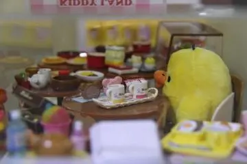 Entire sets of miniature items are displayed to show customers what they are purchasing.