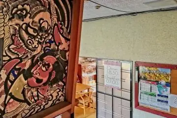 The place is decorated with a lot of paintings and objects