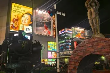 Shimbashi is full of lights and you'll find many people in front of the station on a Friday night (Photo: Manish)