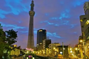 <p>Evening time: Beautiful Tokyo Skytree partially reflecting in the waters below, just before light-up time</p>