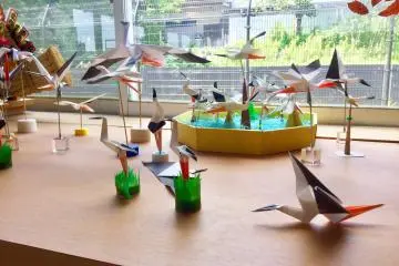 There are paper and textile ornaments made by fans of the storks 