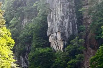 Tateiwa (Shield Rock). The enormity of some of these rock formations are just incredible! To get a better sense of size, find the river boat guide pictured at the bottom.