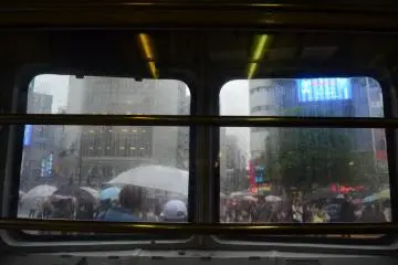 A view of the modern city from the window of the old wheelhouse.