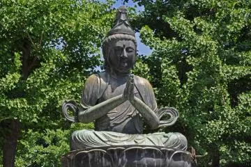 <p>One of the stone Buddhas in the temple grounds</p>