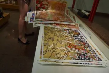 Yuzen washi paper (yuzen patterns were used for kimono printings and are usually very elaborate, often using a lot of gold). They are sold sheet by sheet, but tube carriers for papers and paintings are available for purchase too.