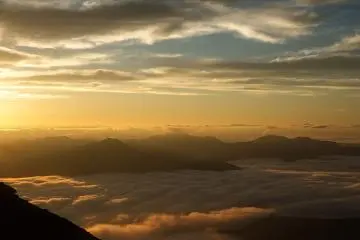 The golden light of sunrise over the valley