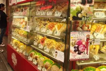 Most crêpe shops have glass cases full of tempting images of all the various kinds of savoury and sweet crêpe fillings. This display is from Marion Crêpes.