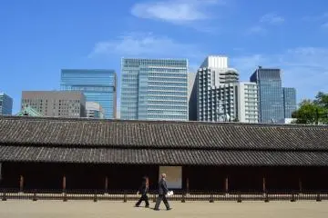 The long defense house beyond tall buildings along another way to the Honmaru Area.