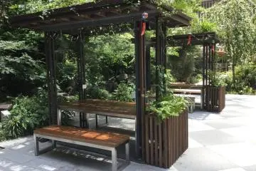 Enjoy eating outdoors at one of these tables cooled by mist.