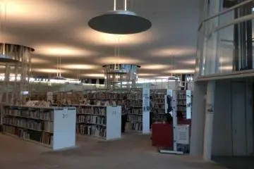 A public library occupies two stories of the building. It is a great place to relax or study.