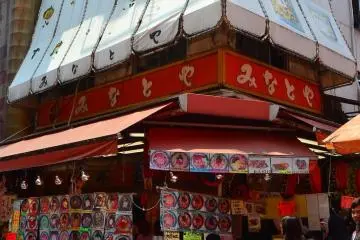 Delicious food stalls on a street corner.