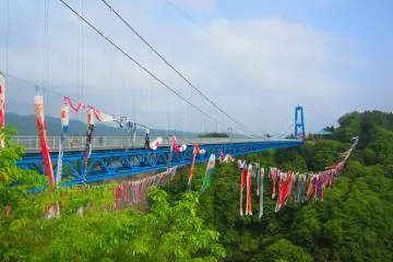 Brilliantly blue Ryujin Bridge with carp streamers