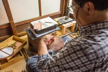Carving out the pattern.