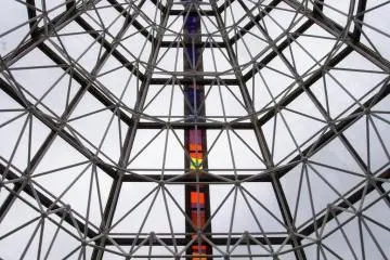 Concical glass entrance evokes image of a traditional tent