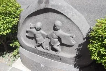 Dosojin (roadside guardian deities) near the station