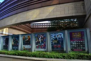 Rows of movie posters in front of the cinema.