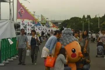 Mascots posing with fans