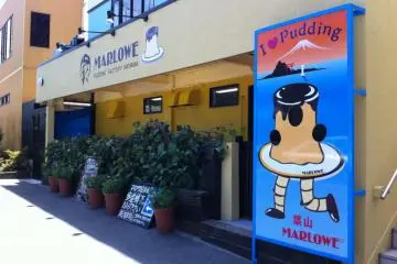 Marlowe Bay-City Cafe's bright-yellow store front of Route 134