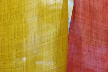colorful noren curtain in front of the kitchen
